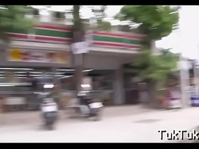 Oriental damsel sucks a penis