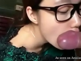 Hot brunette Asian sucks cock